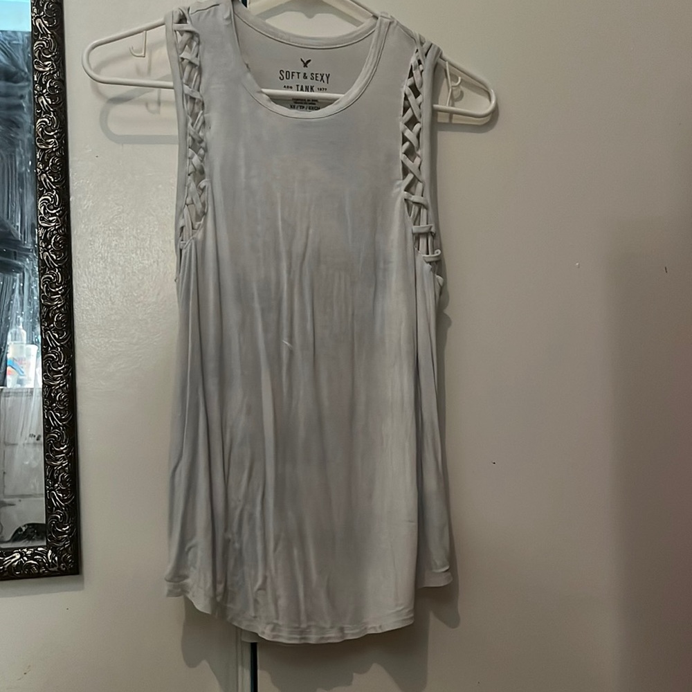 cute flowey tank top, with a criss cross pattern on the sleeves.